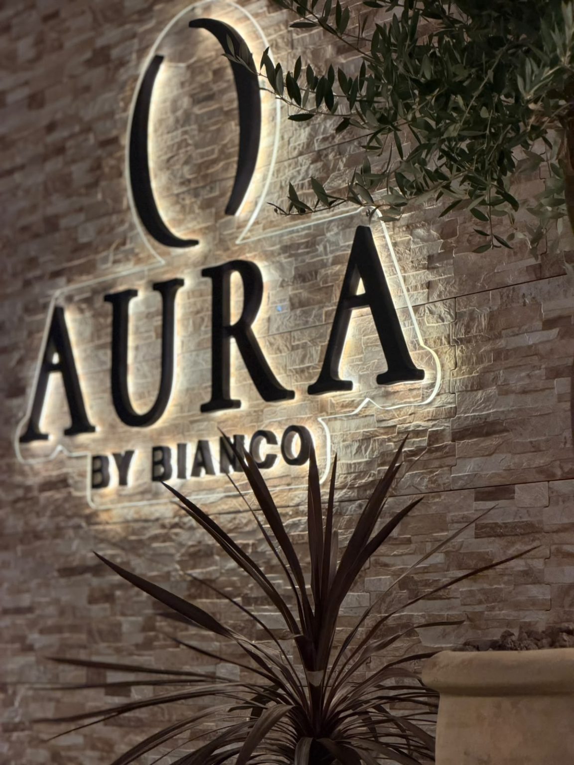 Illuminated AURA by Bianco sign