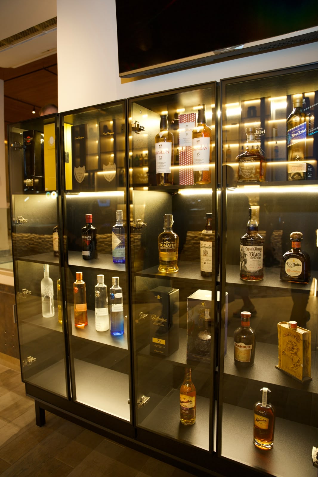 Premium spirits display cabinet at the AURA by Bianco bar